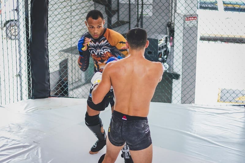 Two MMA fighters fighting.